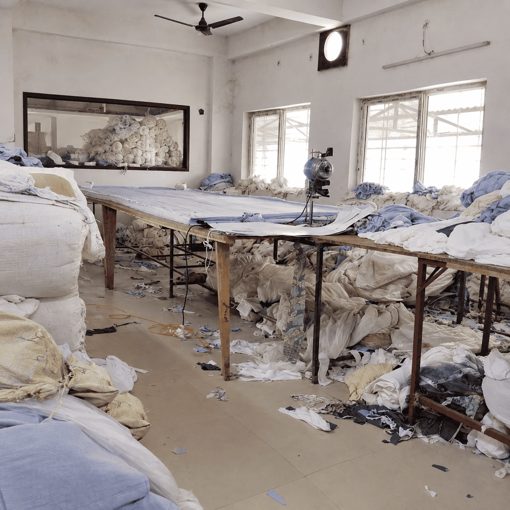 Bulk Chikankari garments being organized and packed for wholesale buyers with careful handling of handmade embroidery.