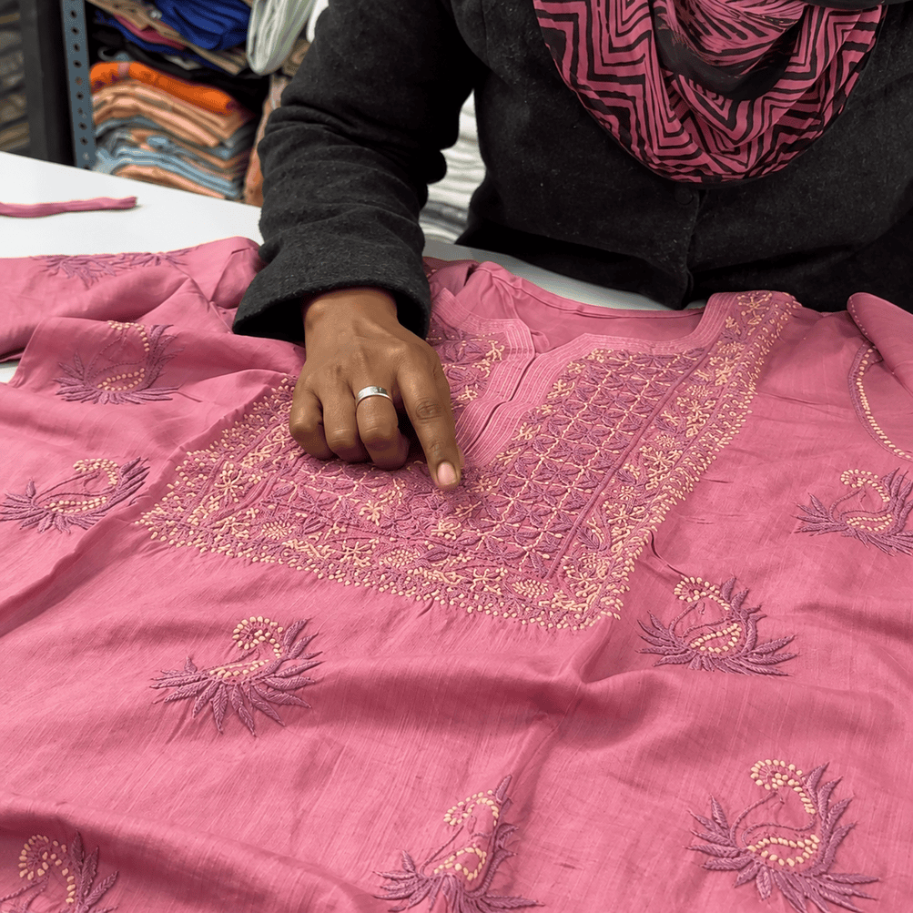 Traditional Lucknow Chikankari artisans carefully embroidering fabric by hand using fine stitches to create detailed and elegant handcrafted designs.